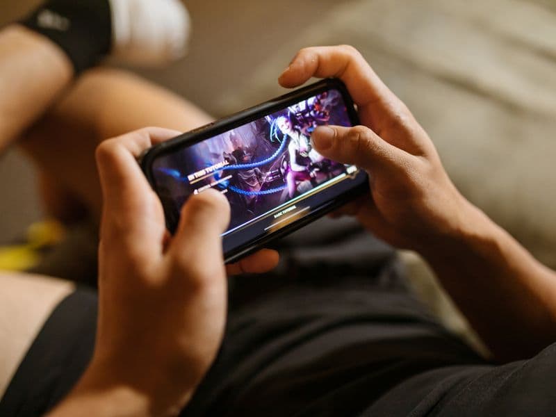 Close-up of someone playing a game on a smartphone